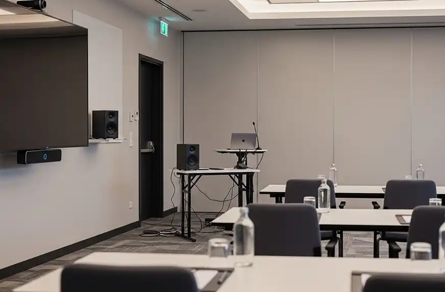 Corporate conference AV setup with LED display and presentation support